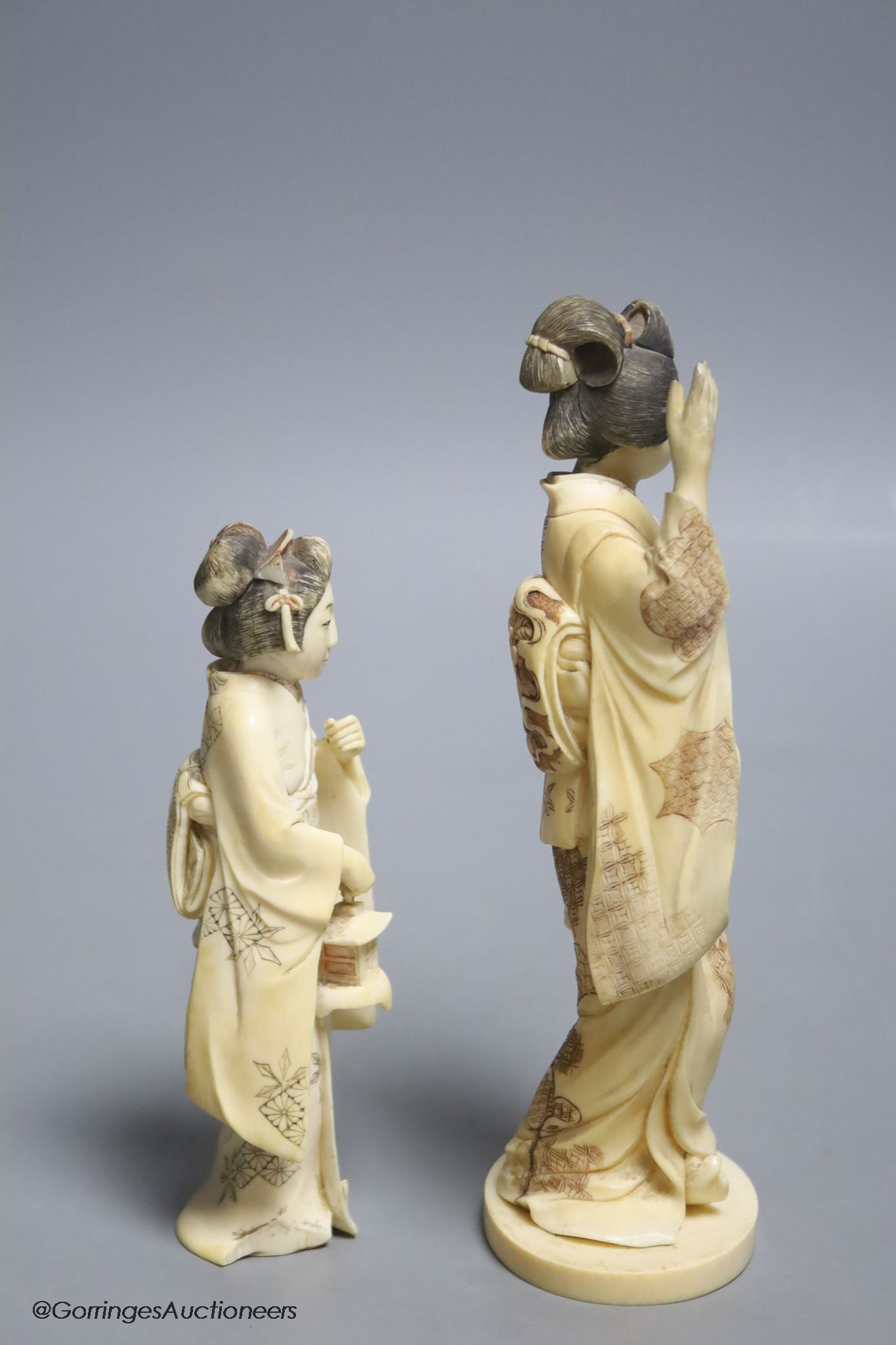 Two Japanese ivory figures of bijin, early 20th century, one signed to the base, height 17.5cm